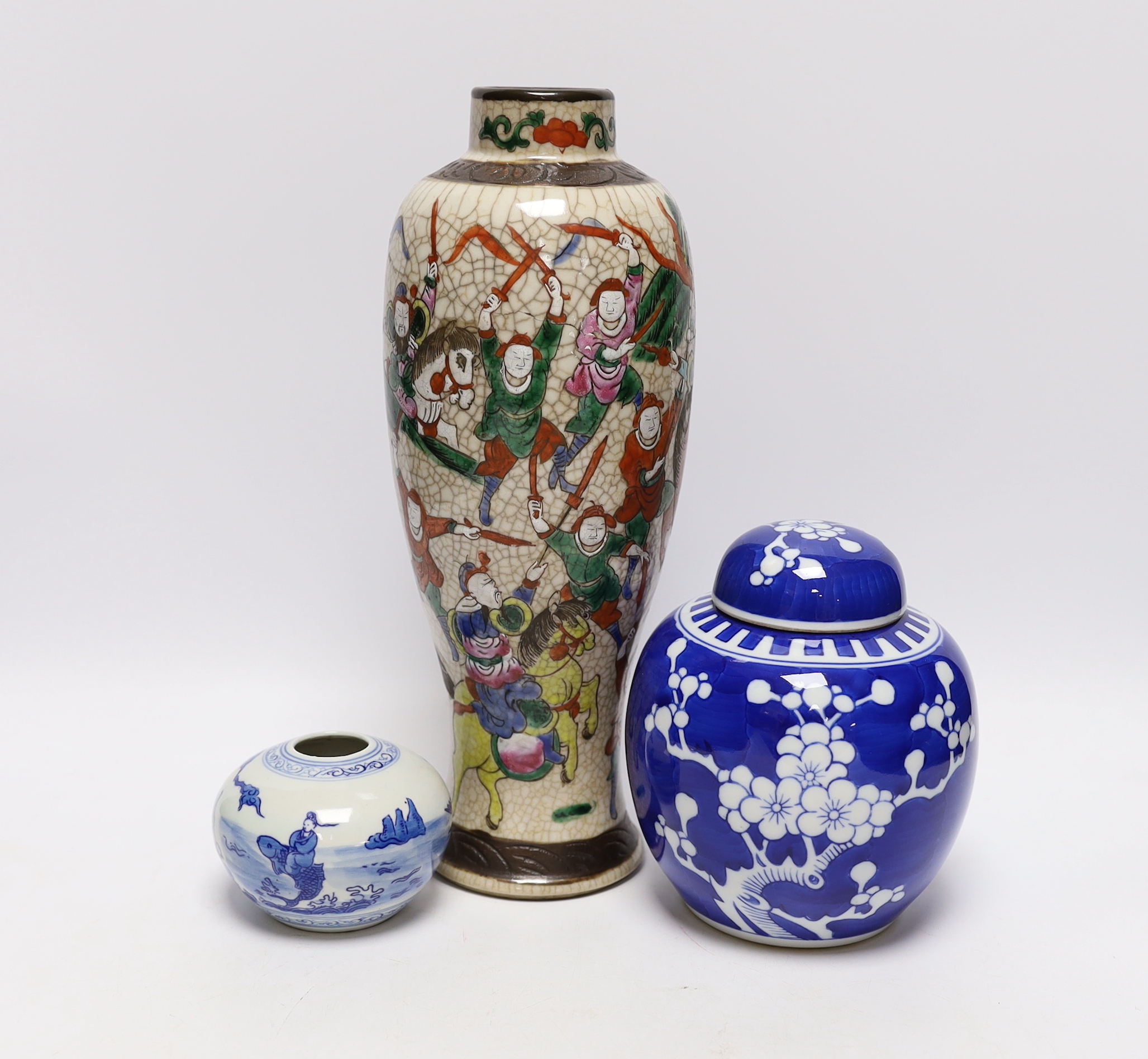 An early 20th century Chinese crackle glaze vase and two blue and white jars, largest 30cm high